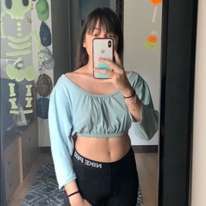 Crop blue blouse with extended neckline
